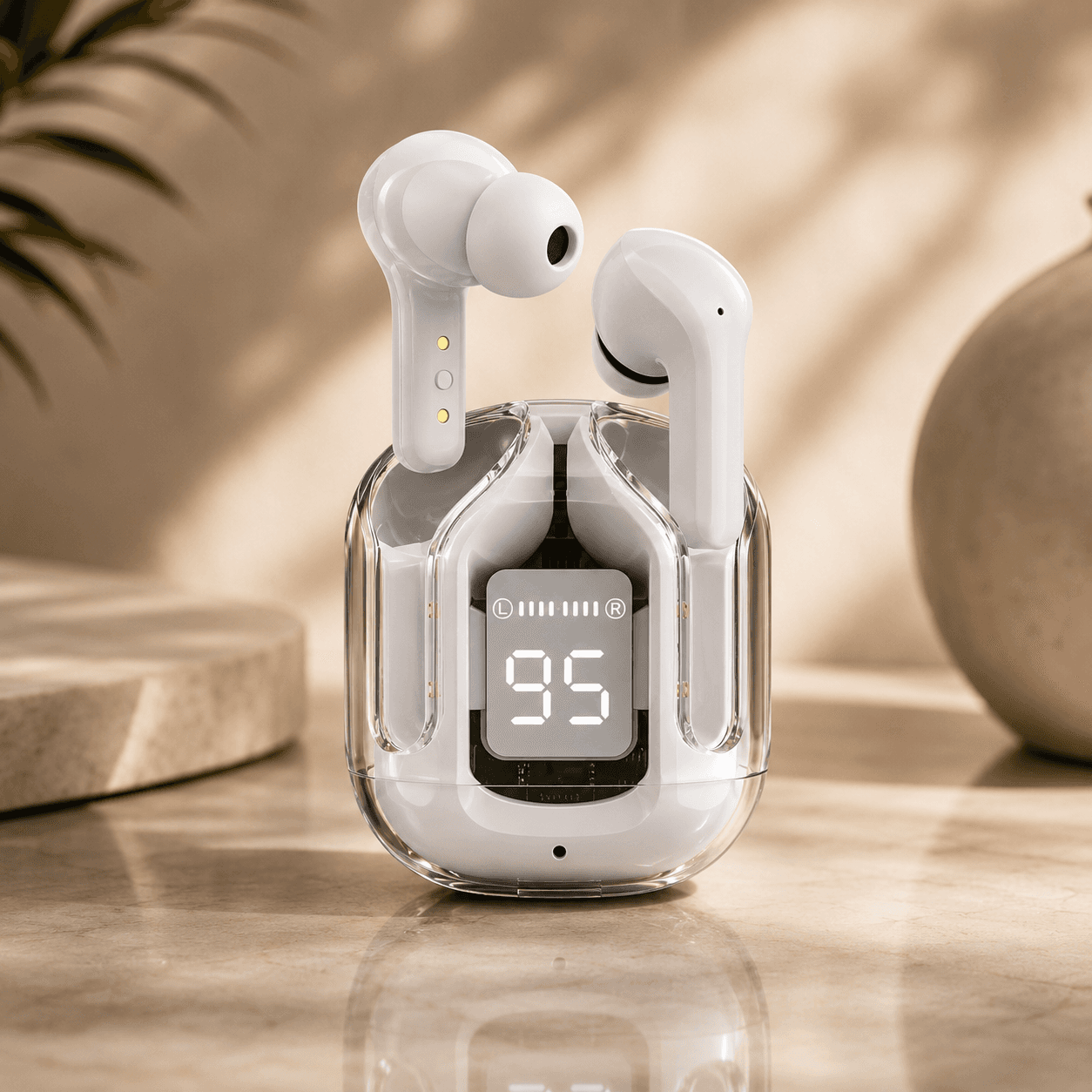 White wireless earbuds in a clear charging case with a digital LED display