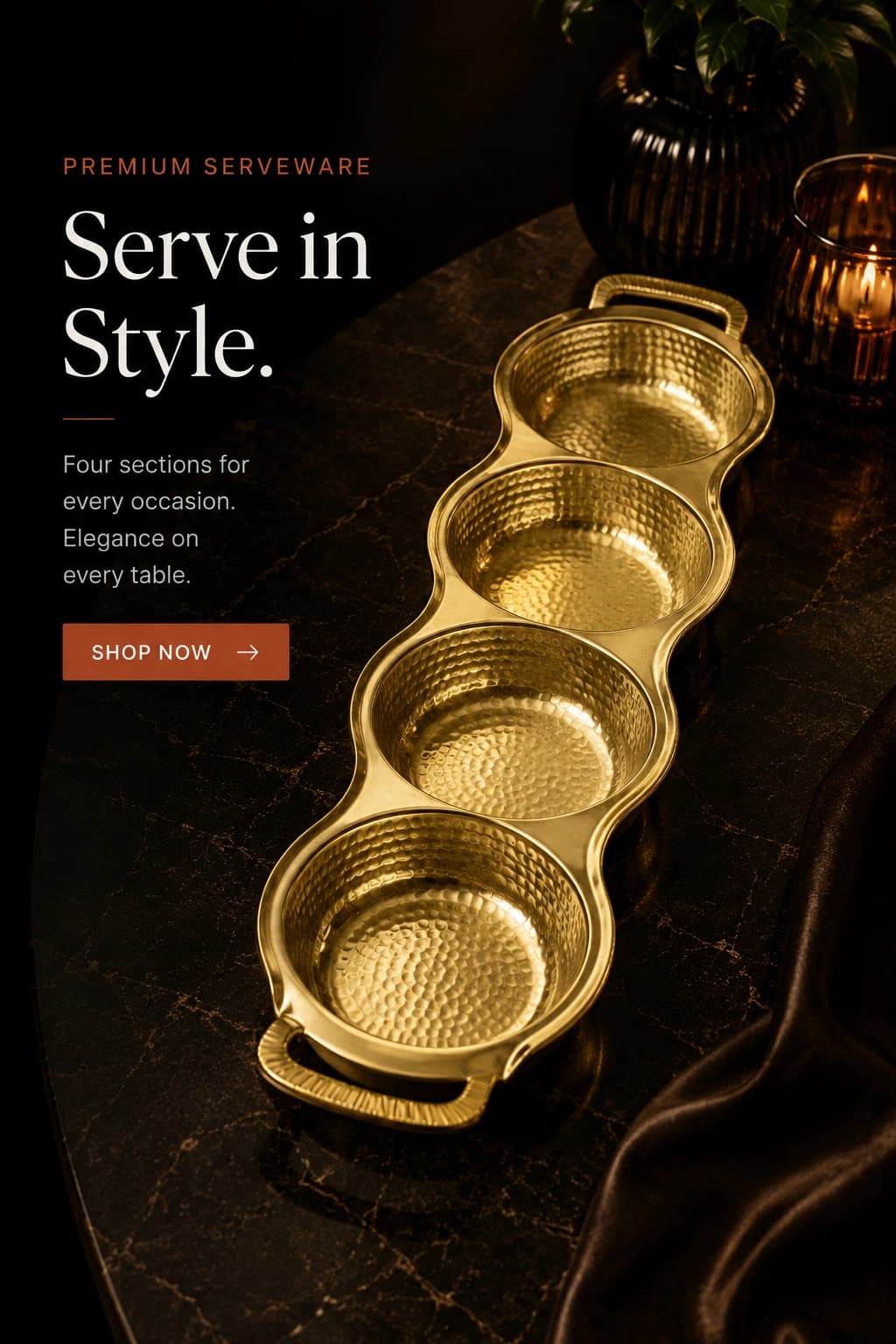 Hammered gold 4-section serving tray with carry handles, on a dark marble table